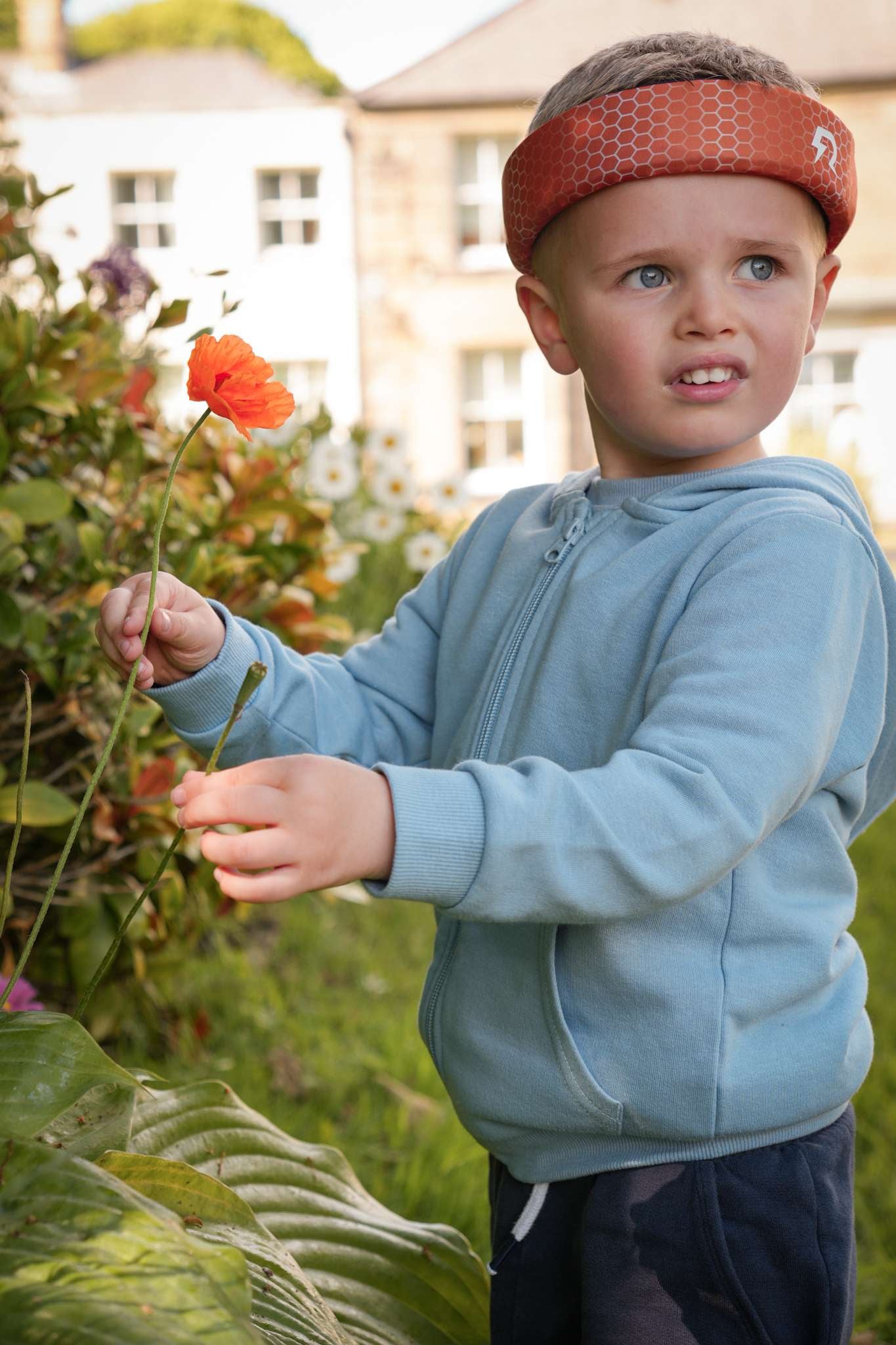 A boy with autism wearing Rezon Halos® brain protection. A boy with autism wearing Rezon Halos® brain protection.