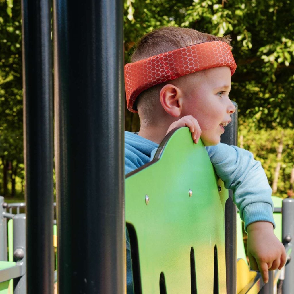 A young boy with epilepsy wearing Rezon Halos® brain protection.